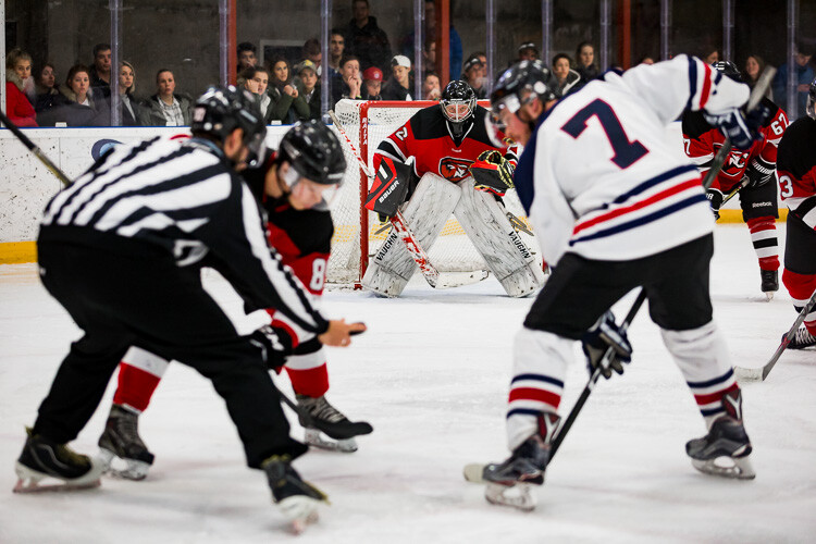 The final edited image of a hockey goalie waiting for the puck to drop - Tips for Editing Hockey Photos in Lightroom